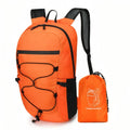 Orange packable daypack with a black bungee cord and mesh side pocket, beside its matching stuff pouch