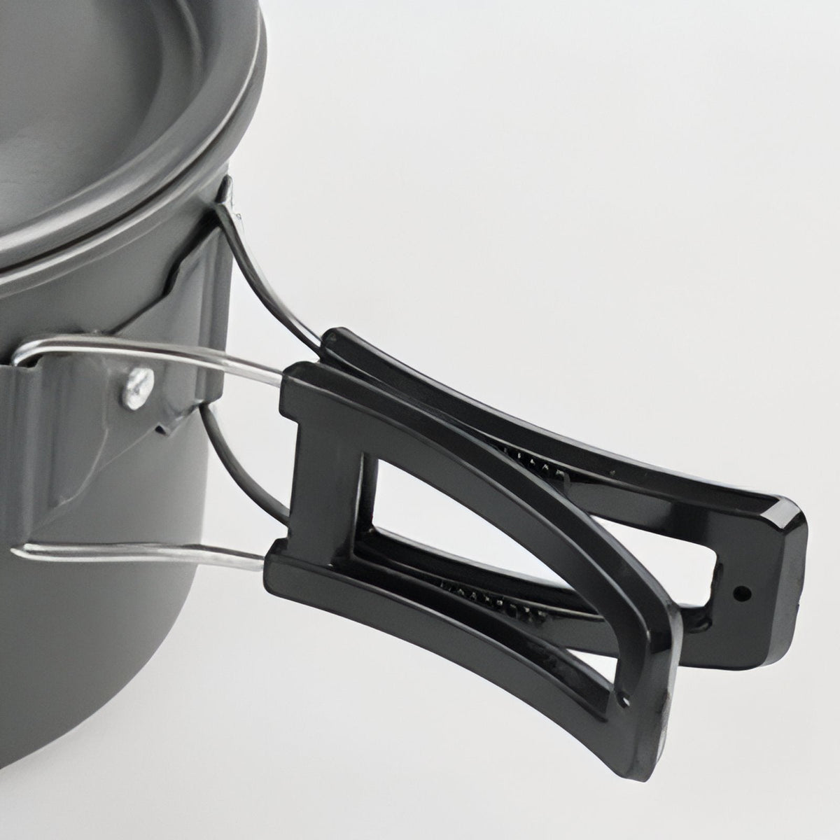 Close-up of a folding handle with its heat-insulating cover