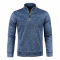 Heather blue men's quarter-zip pullover with a stand collar, lime zip piping and a small tan tab at the hem, front view