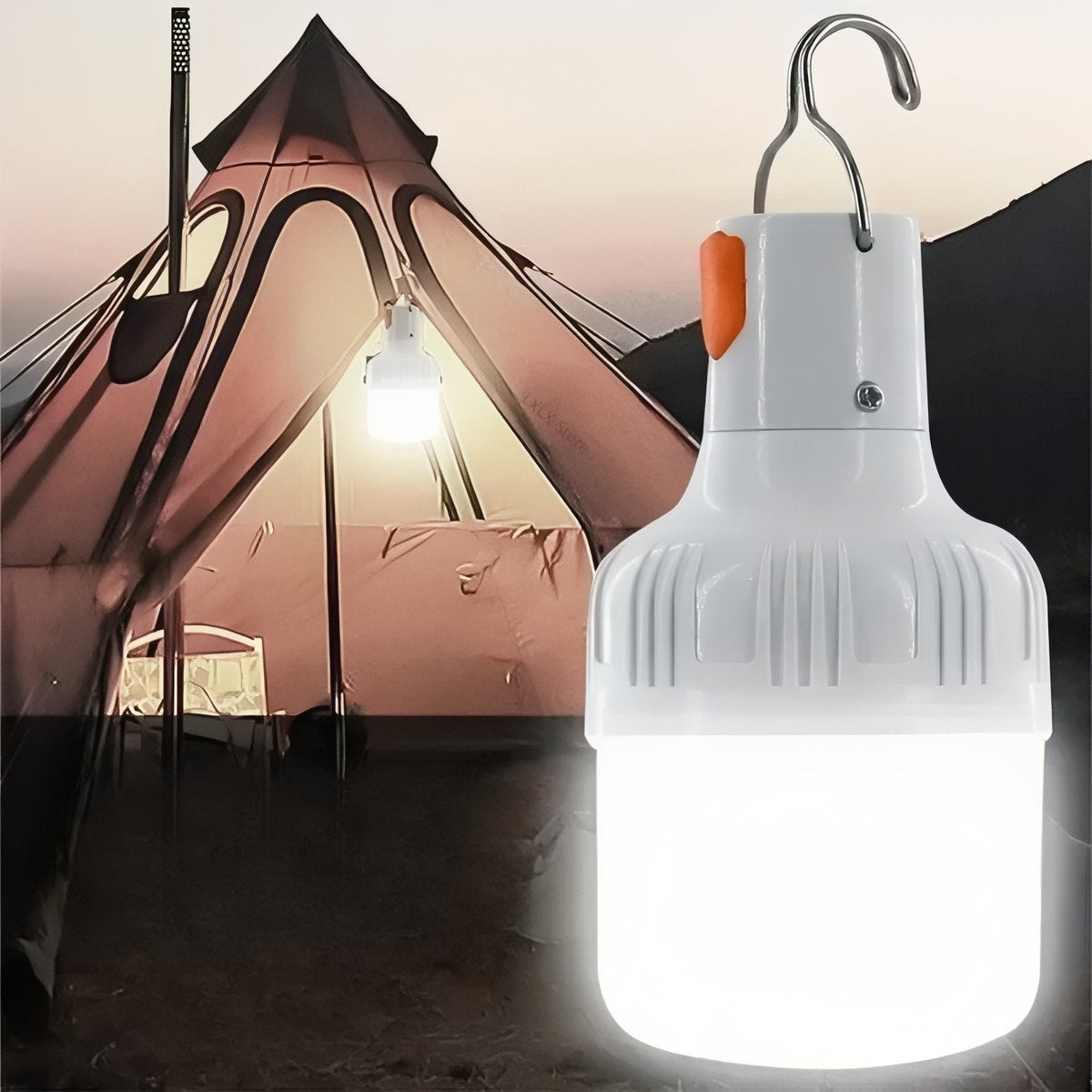 LED bulb lantern glowing in front of a lit tent at dusk