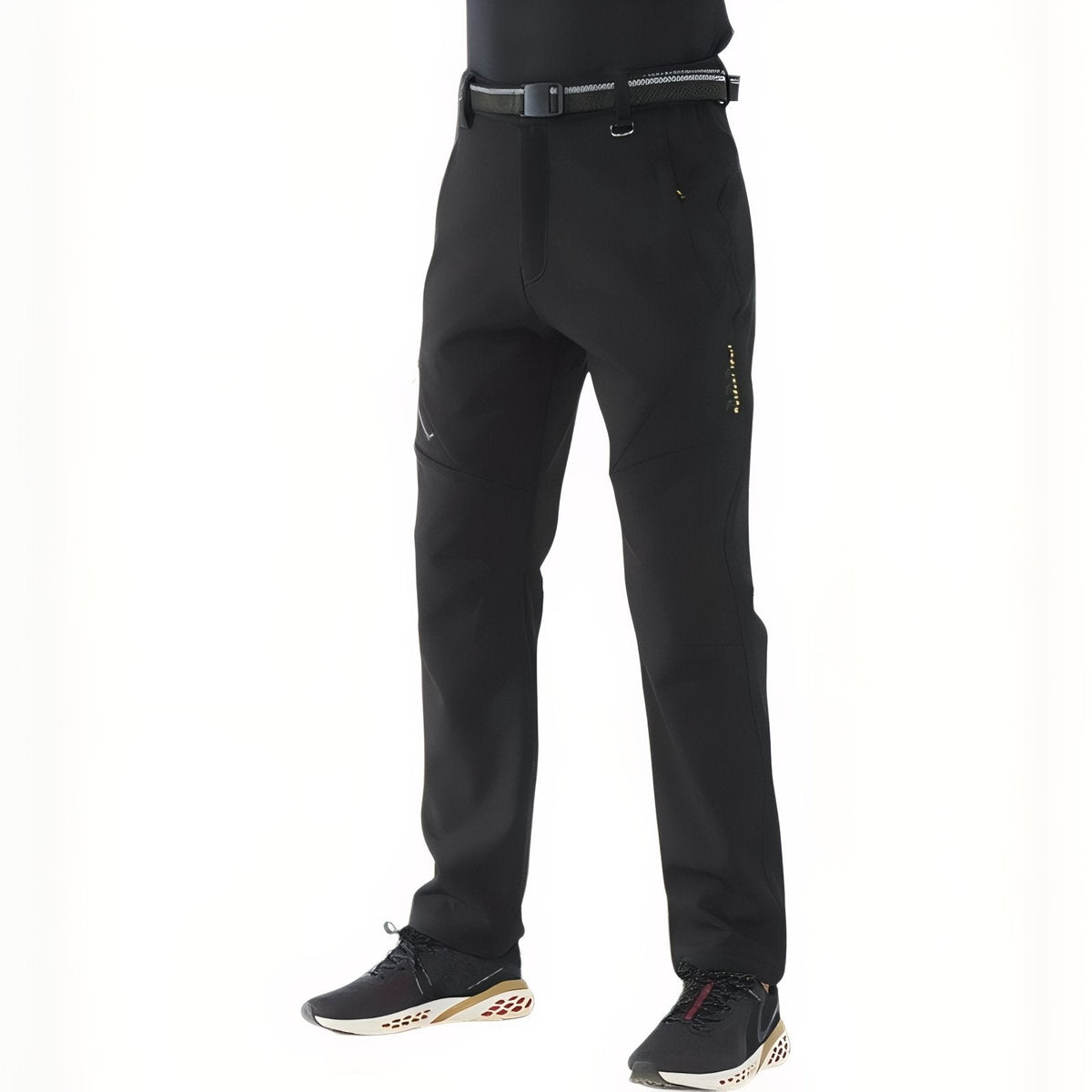 Man wearing the black softshell hiking trousers with a belt, three-quarter view