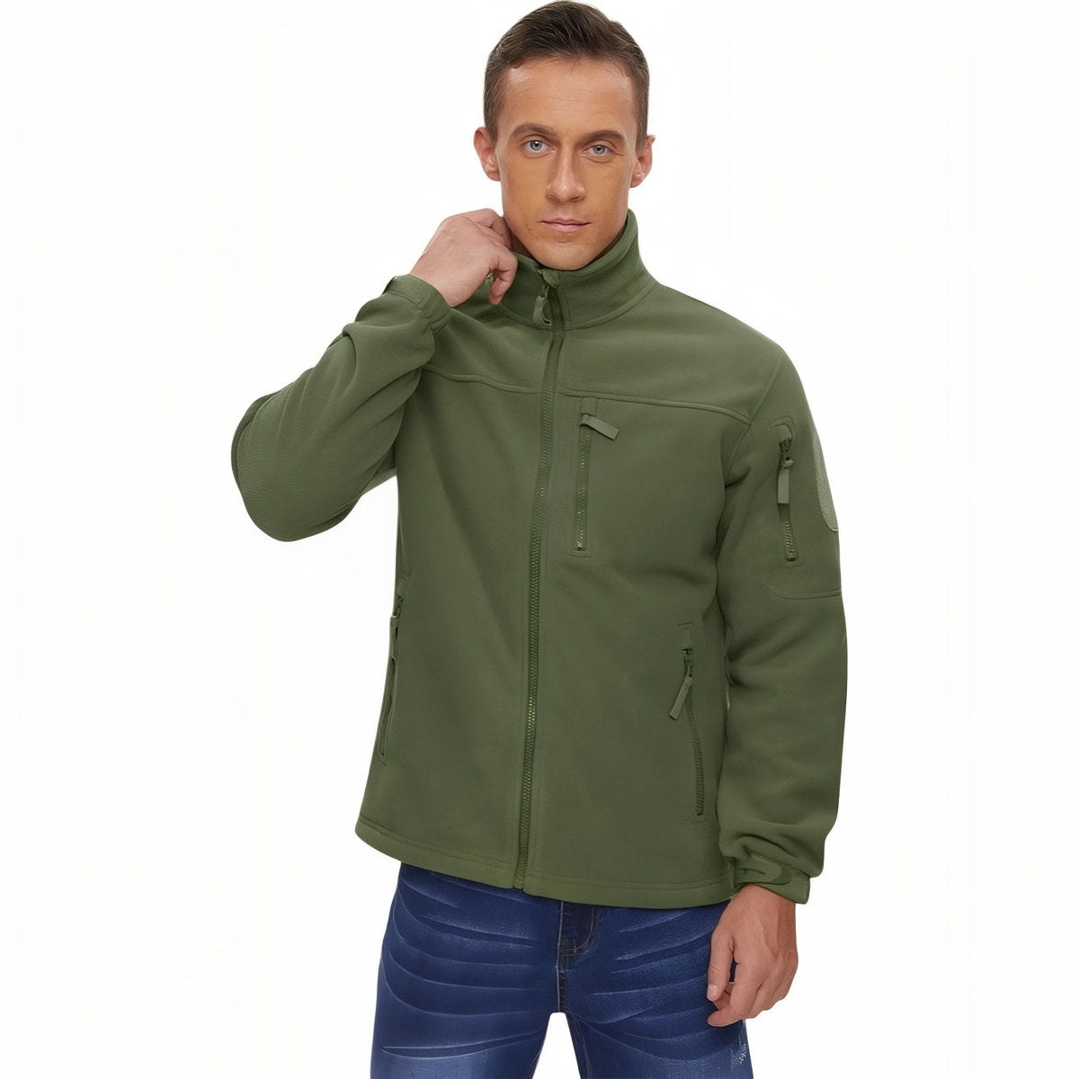 Man wearing the olive green tactical fleece jacket zipped up, adjusting the stand collar