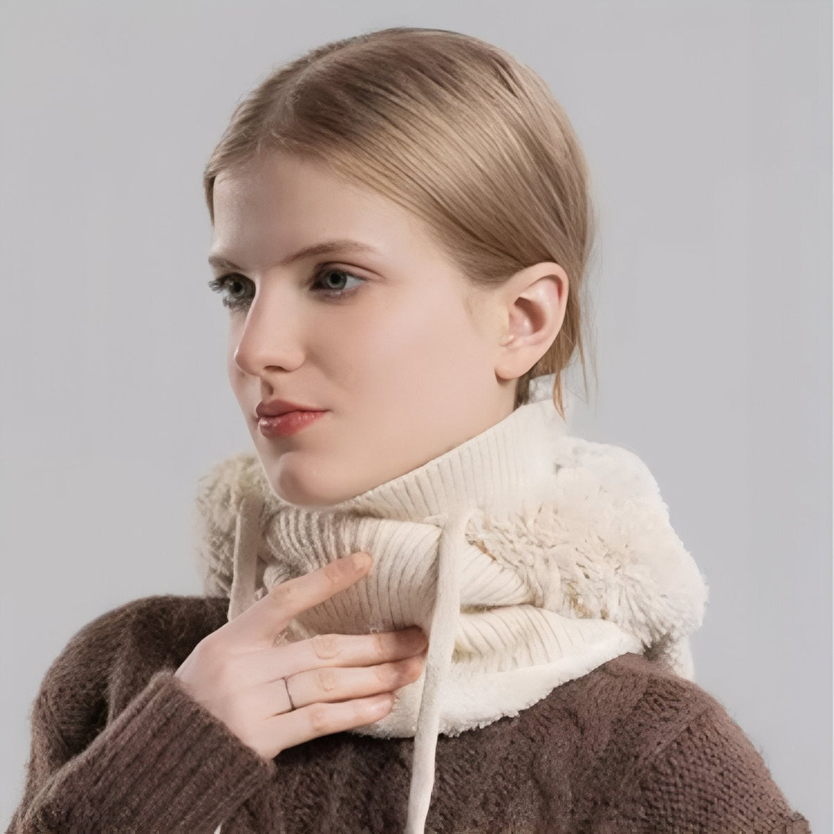 Cream white balaclava worn down around the neck as a snood, faux-fur hood resting on the shoulders