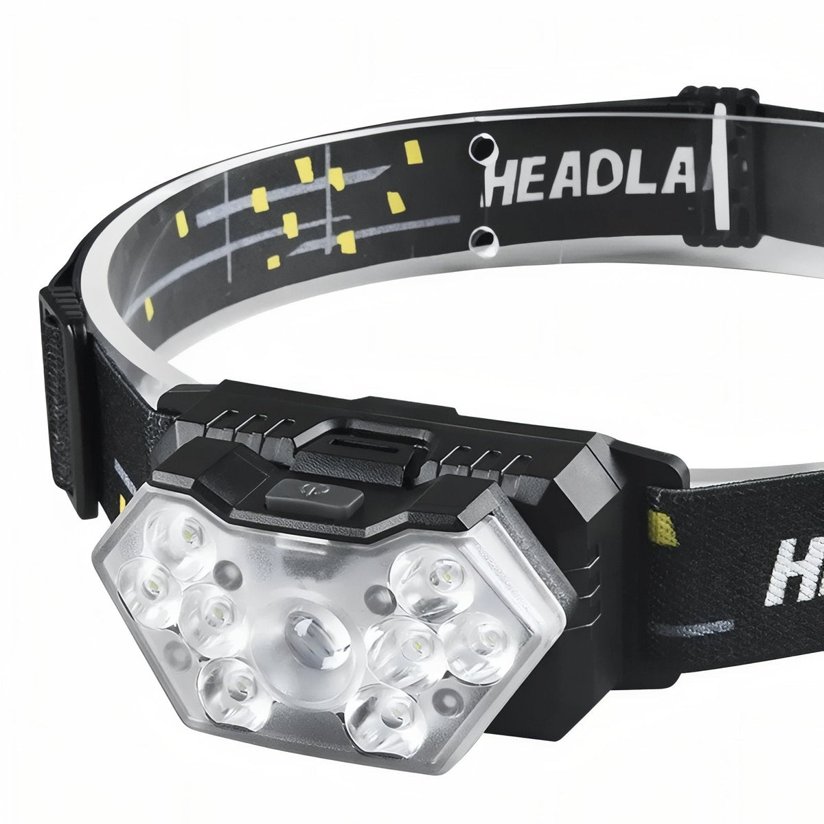 Headlamp on its headband seen from a low angle on white