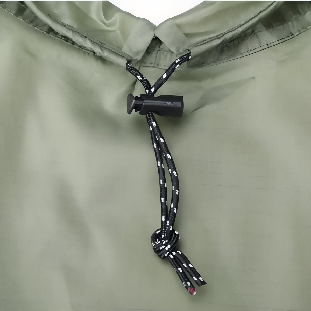 Close-up of the olive green poncho hood drawcord with a black toggle