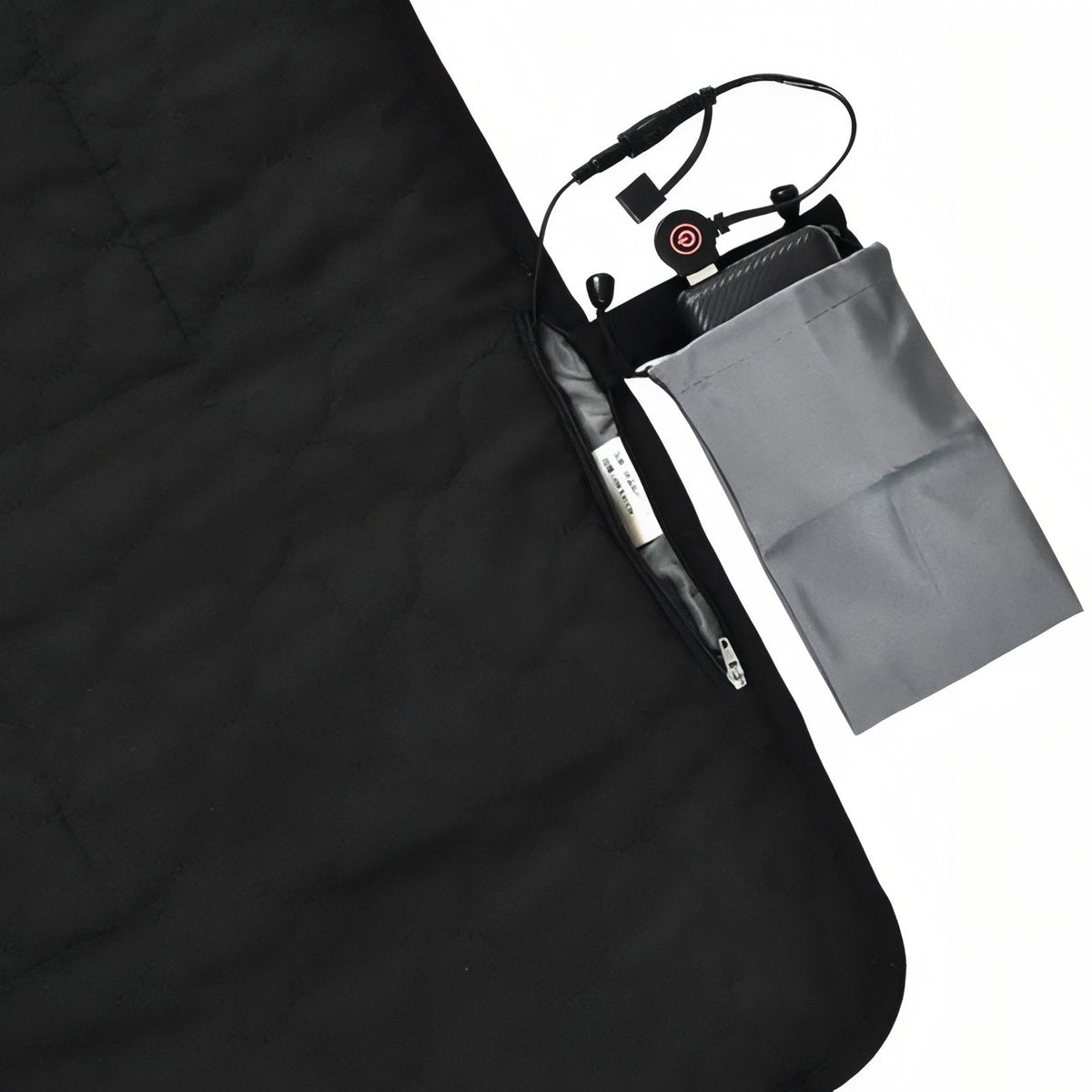 Black heated sleeping pad with the power bank pouch and controller cable at its zipped side pocket