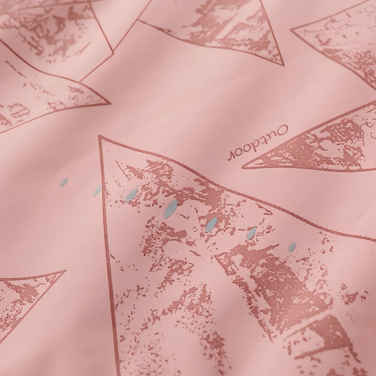 Close-up of the pink geometric line print on the jacket fabric