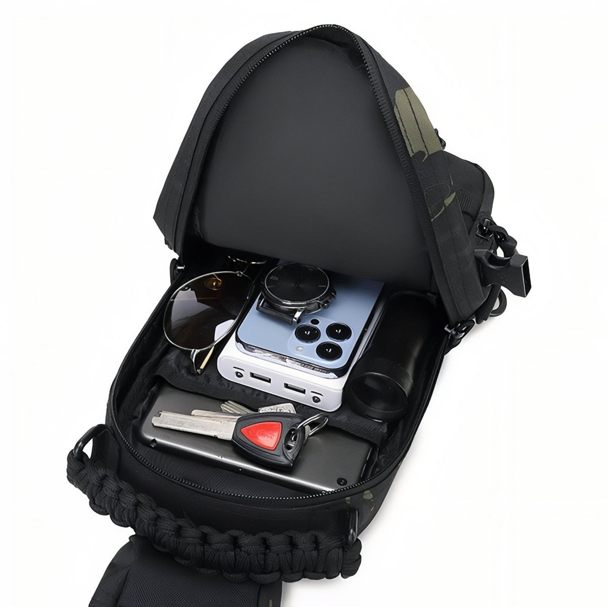 Open sling bag holding sunglasses, a watch, a phone, a power bank, a torch and keys