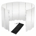 Folding aluminium stove windscreen standing in a curve, with its black drawstring bag in front