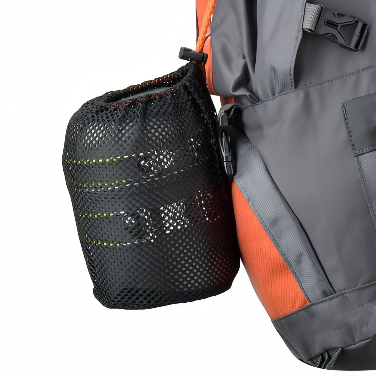 The cook set packed in its black mesh bag, hanging from the side of a rucksack