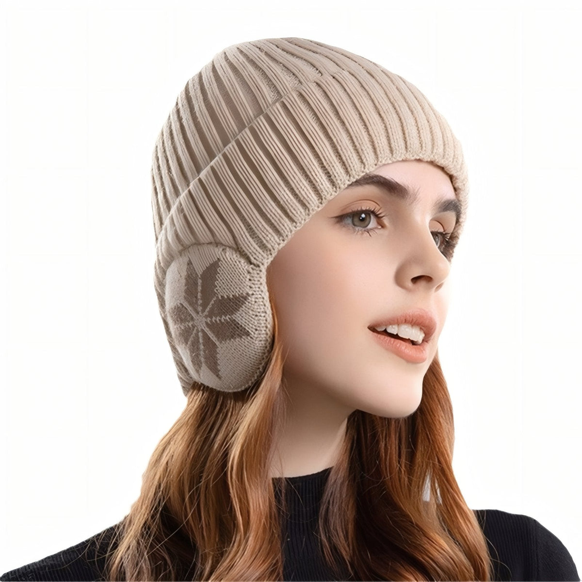 Woman wearing the light beige ribbed knit beanie with the snowflake ear flaps down over her ears