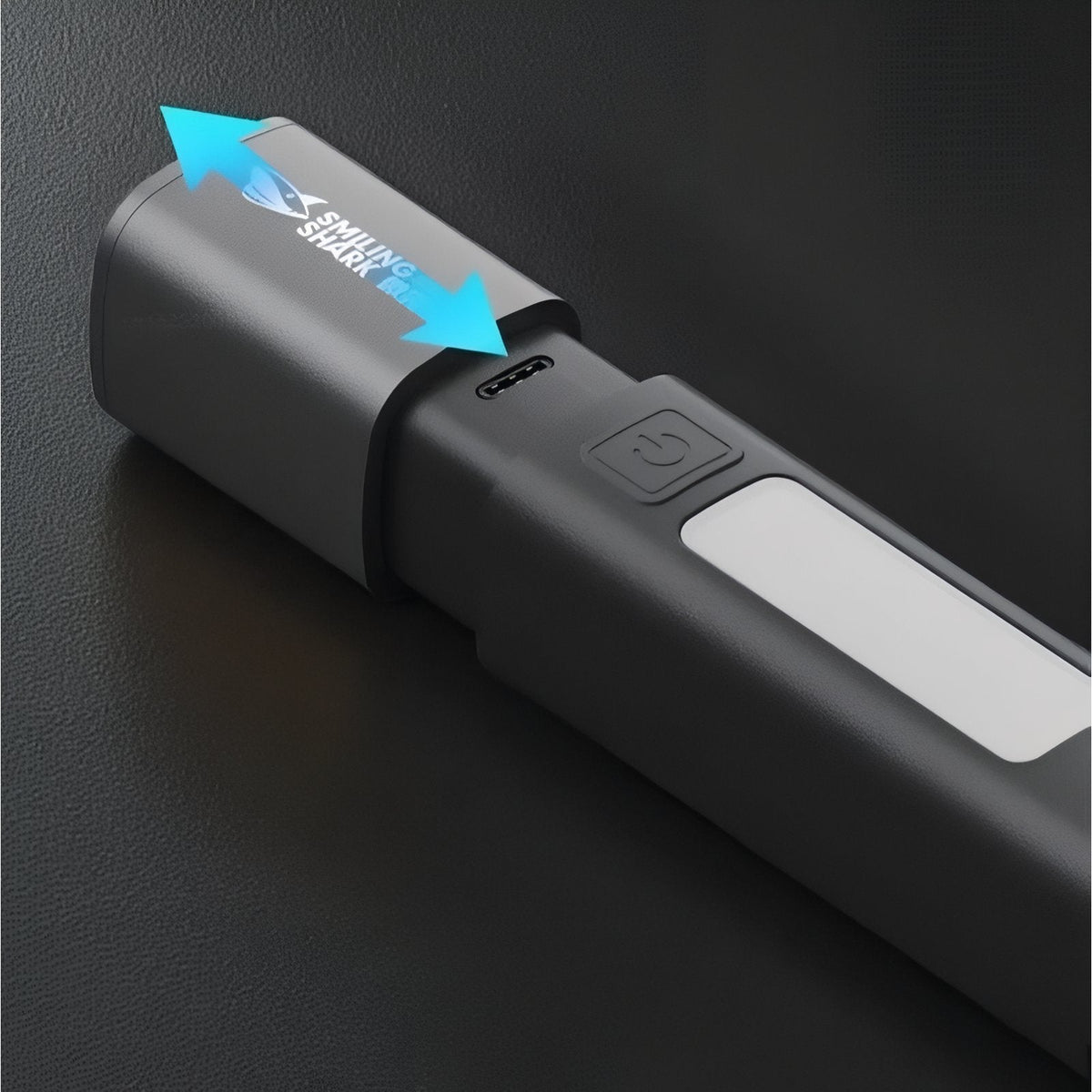 Close-up of the switch and the charging port under its sliding cover