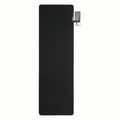 Black heated sleeping pad seen from above with its power bank pouch at the side