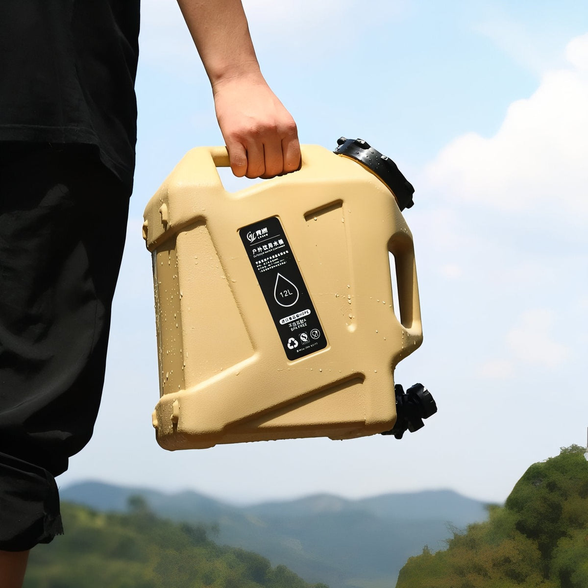 Hand carrying the sand water container by its top handle in the hills