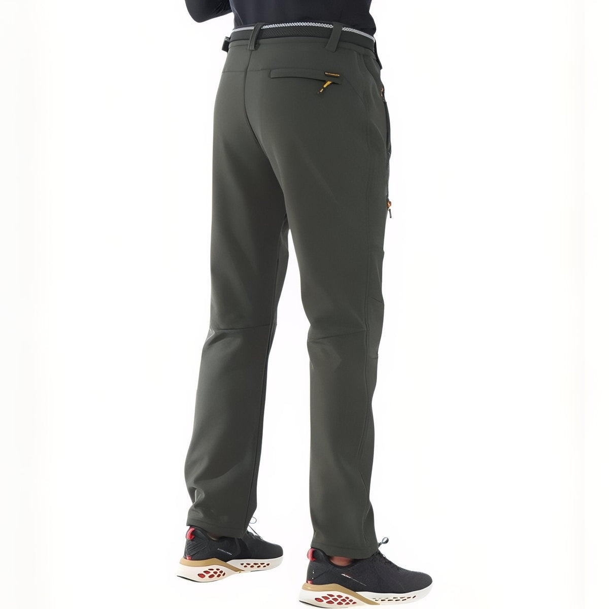 Back view of the dark green softshell hiking trousers worn, showing the zipped back pocket