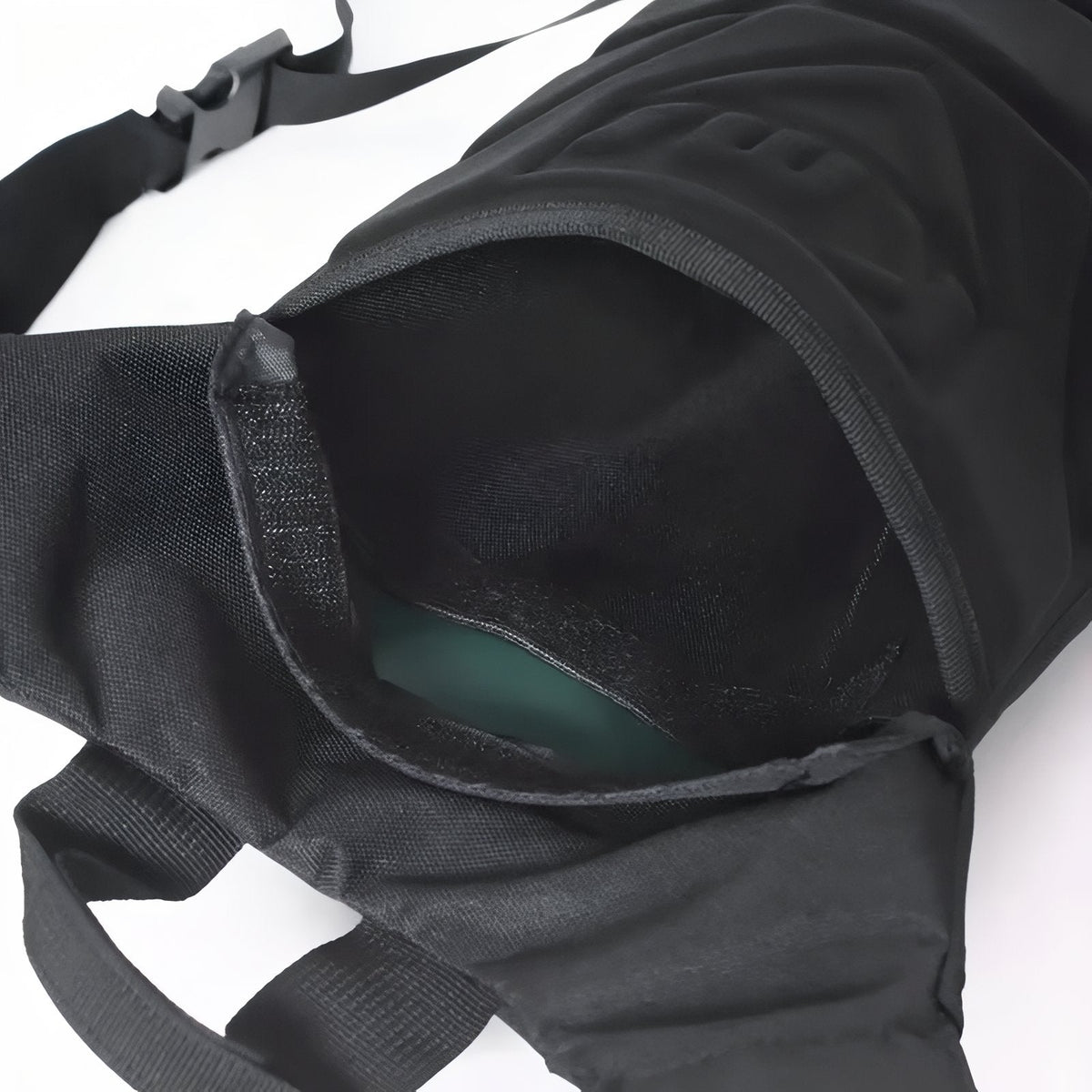 Close-up of the hydration pack's main opening with the green bladder inside