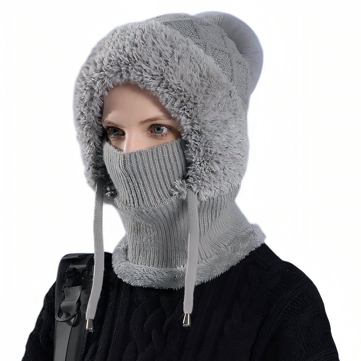Woman wearing the light grey balaclava hood with grey faux-fur surround and rib-knit mask