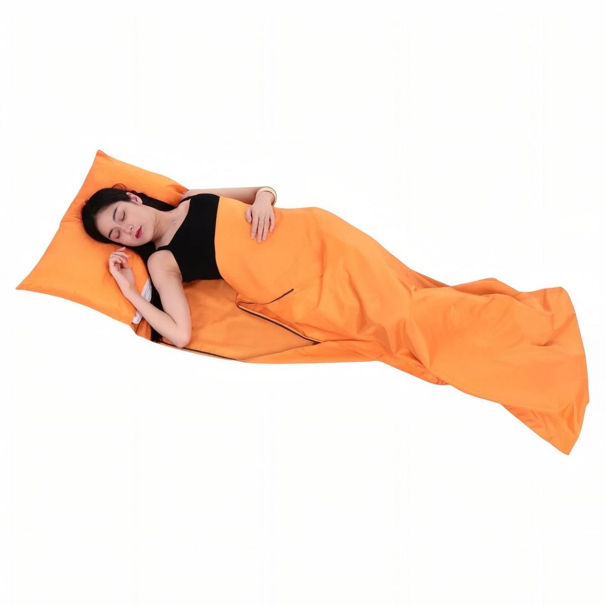 Woman asleep in the orange sleeping bag liner with a pillow tucked under the head flap