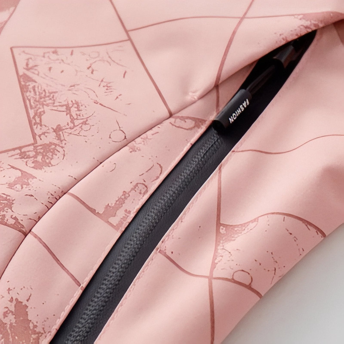 Open zipped pocket on the pink jacket showing the dark zip tape