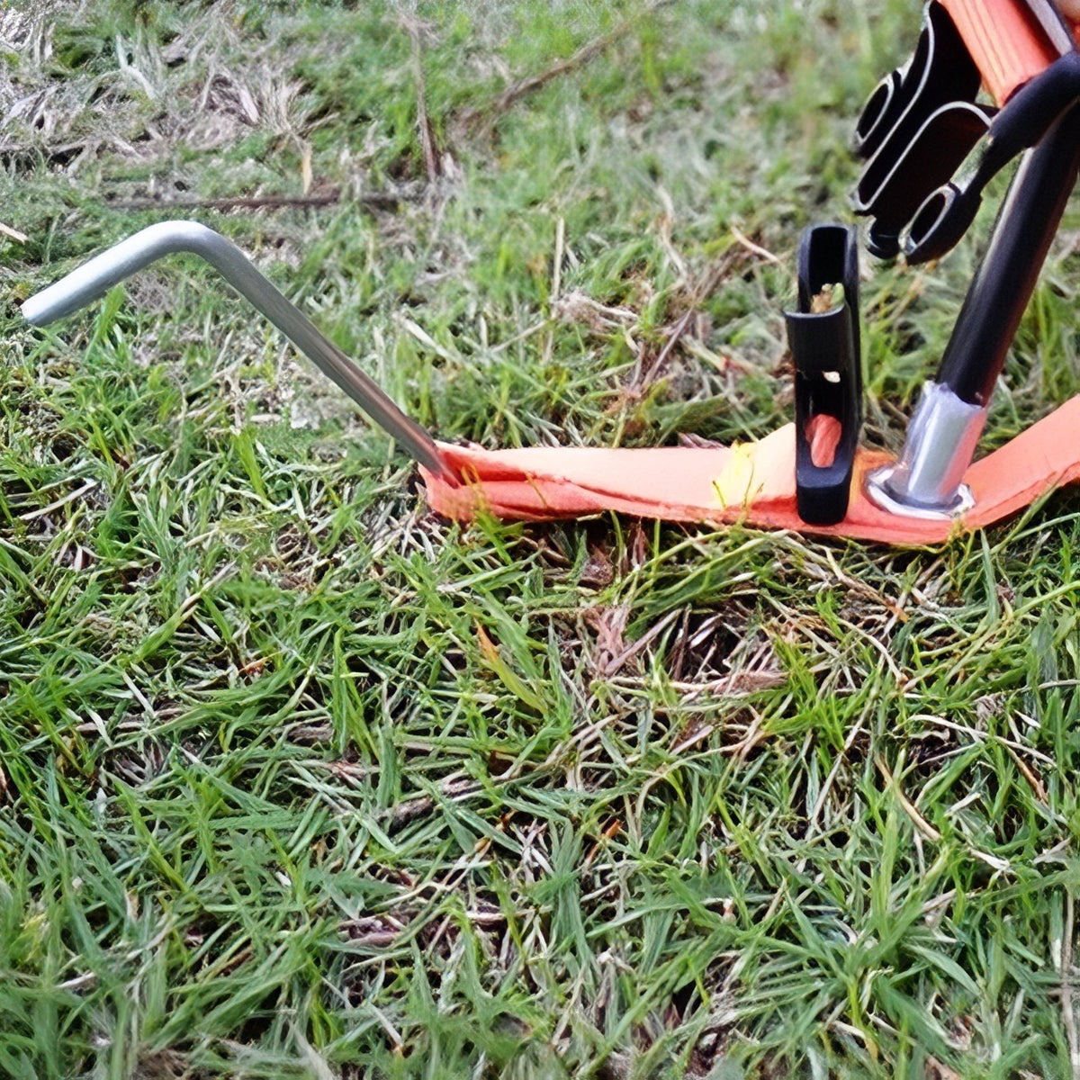 Pole tip in the corner eyelet with a tent peg