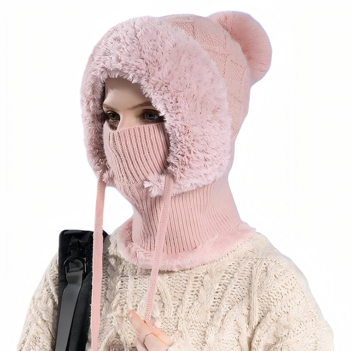 Woman wearing the pink balaclava hood with pink faux-fur surround and rib-knit mask