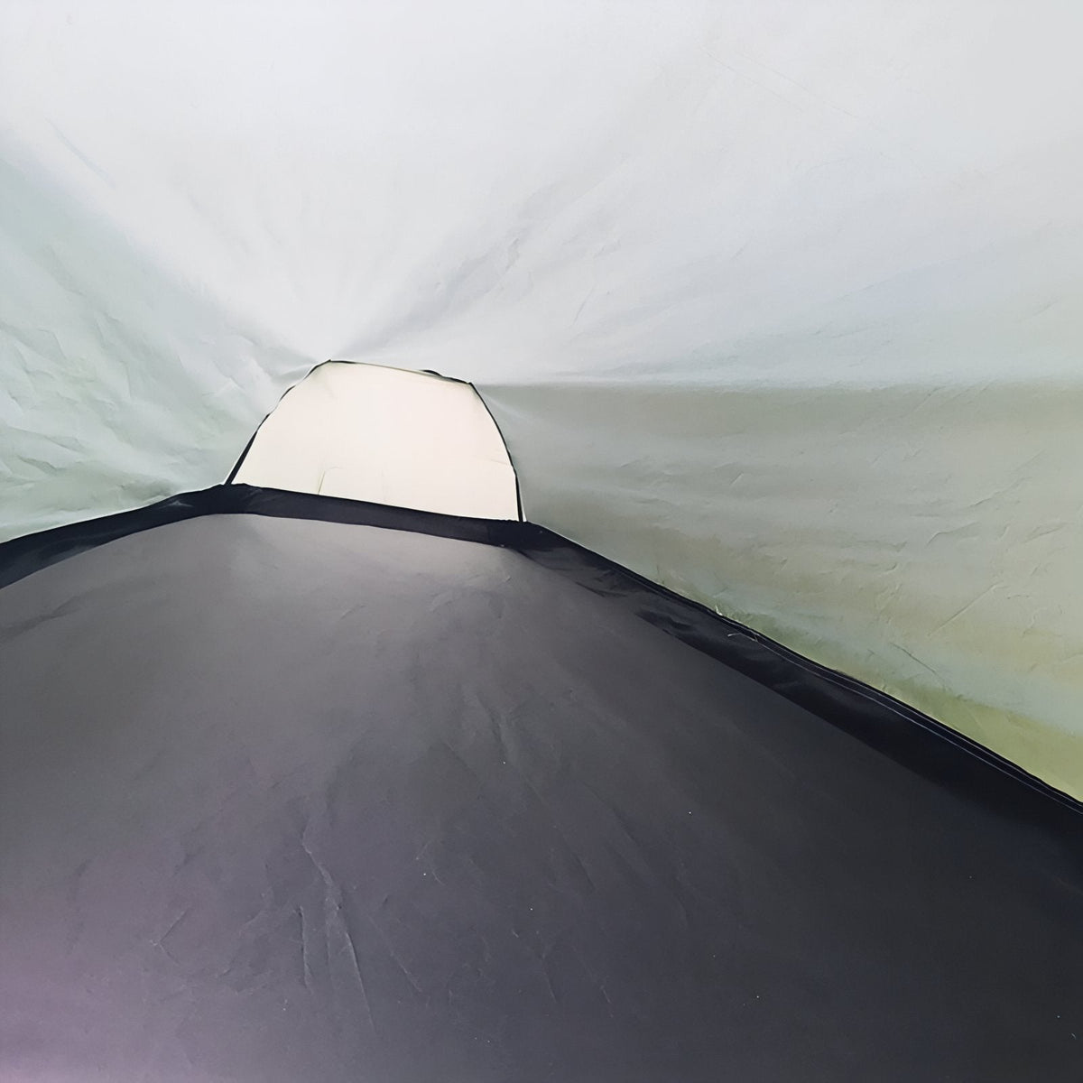 Inside of the bivy tent looking toward the head end, with its black floor