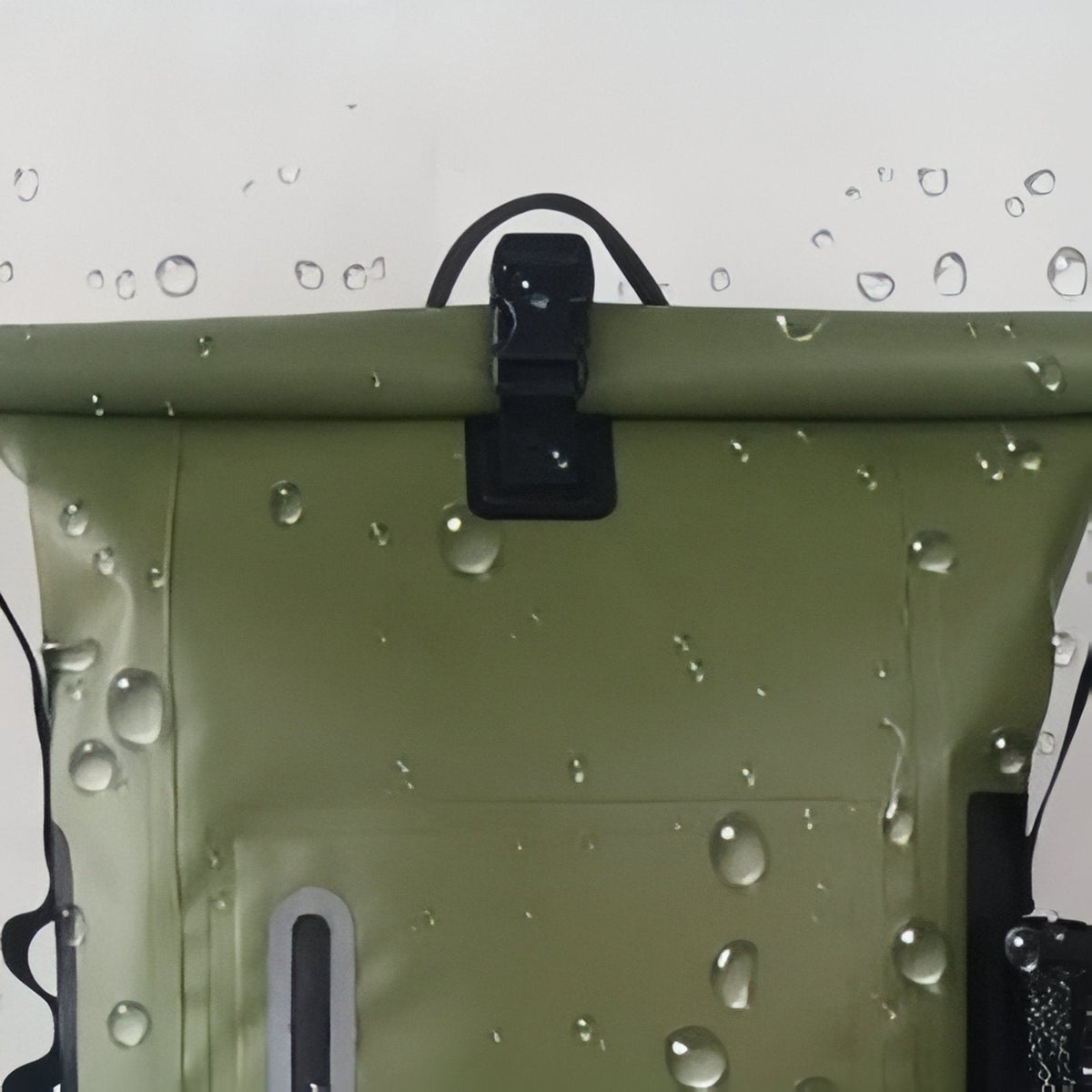 Water drops on the olive green PVC under the roll-top buckle
