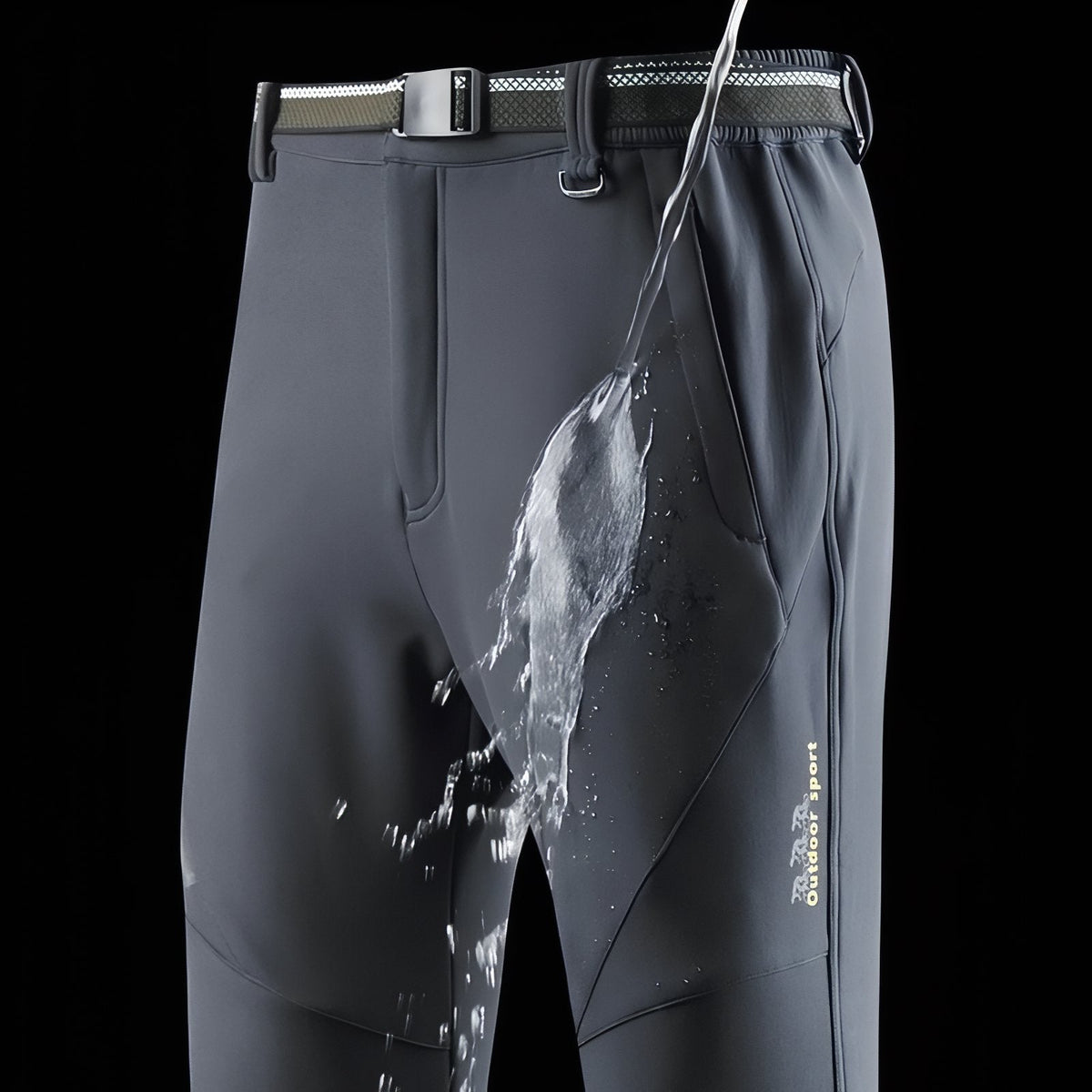 Water running off the front of the slate grey softshell trousers