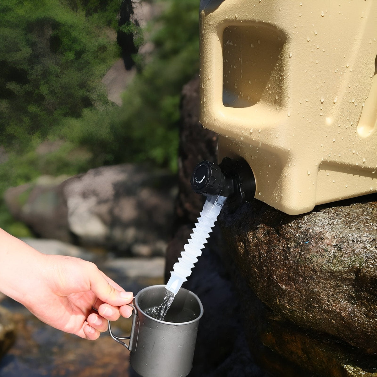 Water running from the tap and extension tube of the container into a metal cup