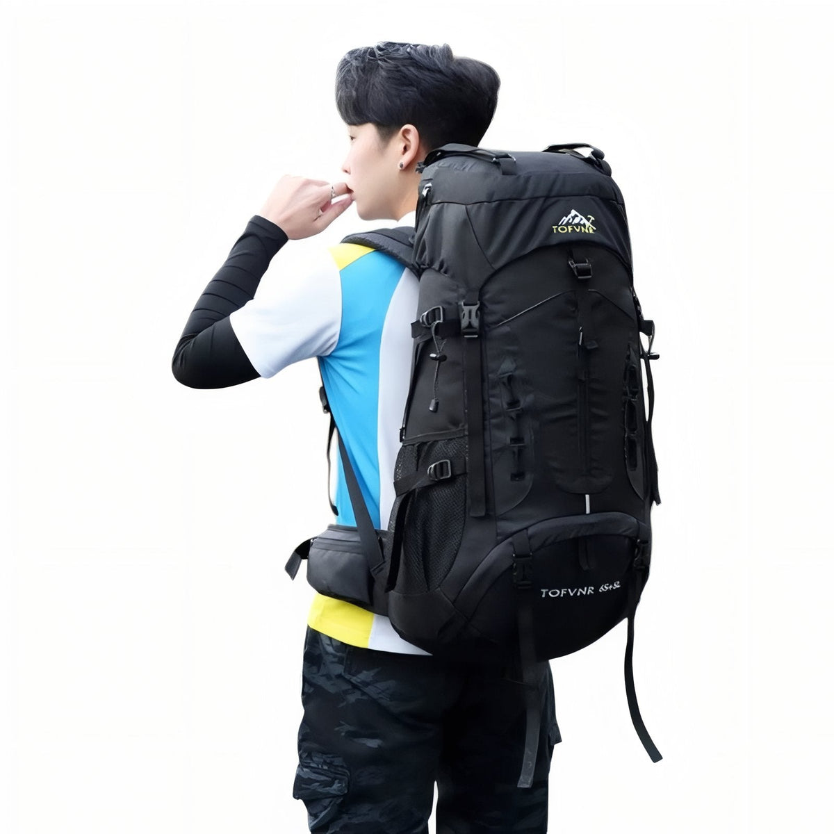 Man wearing the black hiking backpack with the hip belt fastened