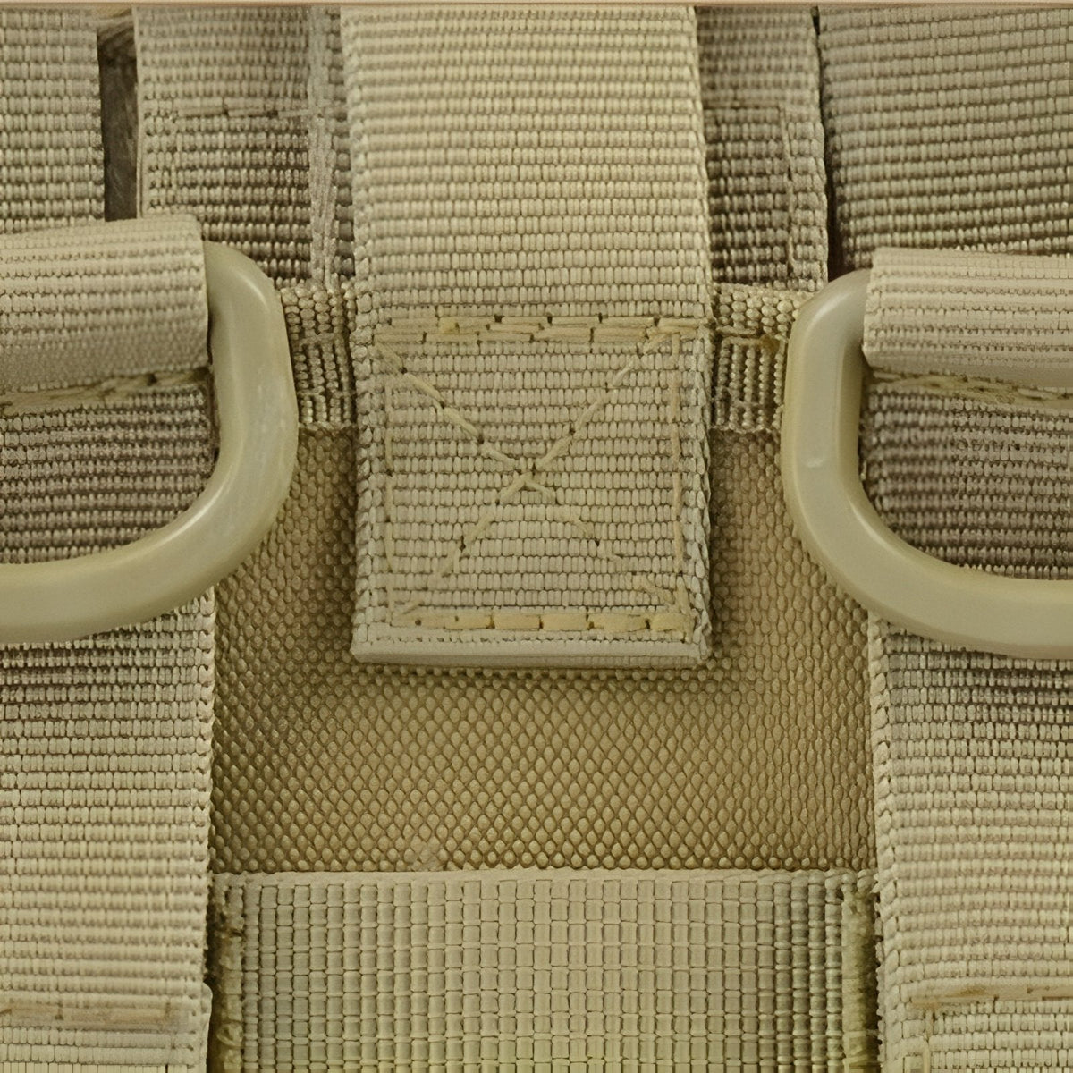 Close-up of the khaki webbing loops on the back of the pouch
