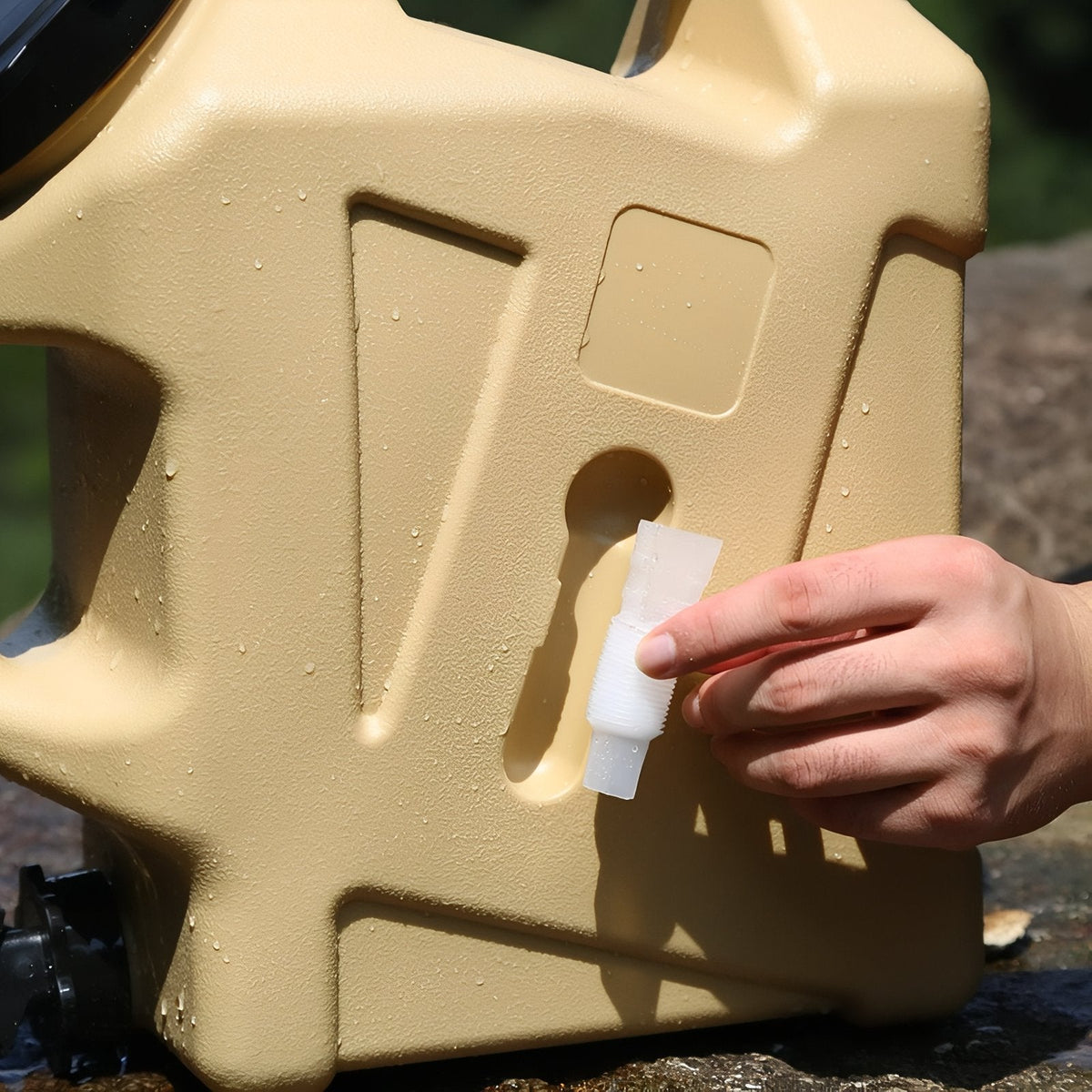 Hand fitting the small replacement cap into the side opening of the container
