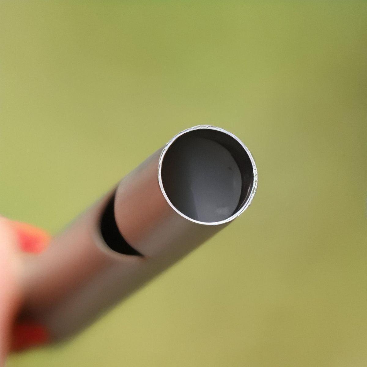 Close-up of the open mouthpiece end of the whistle
