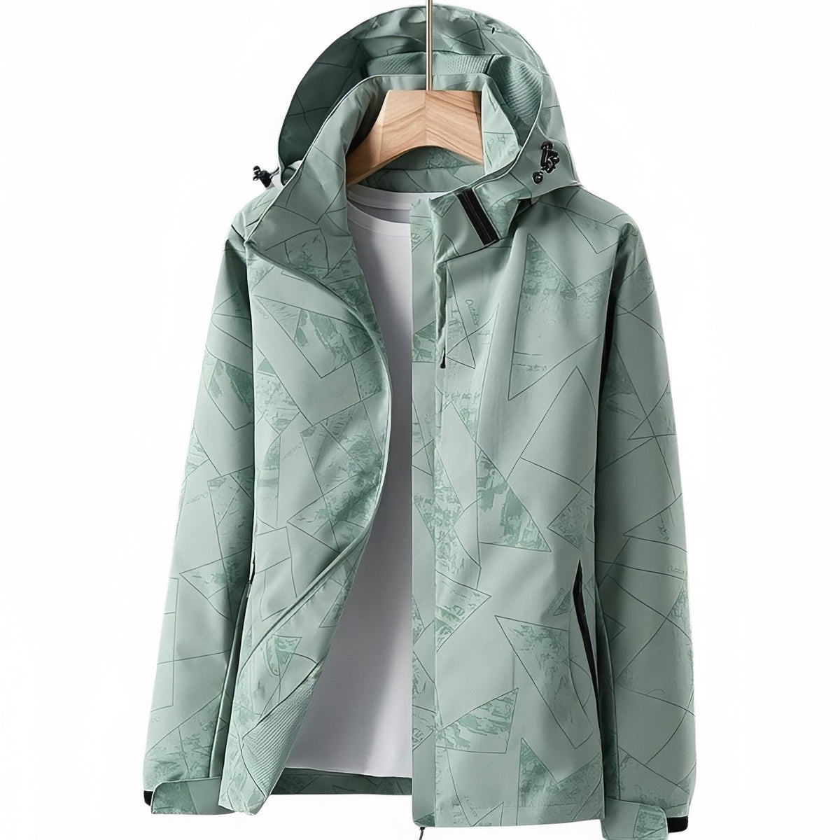 Sage green hooded hiking jacket with a geometric line print, hanging open on a wooden hanger