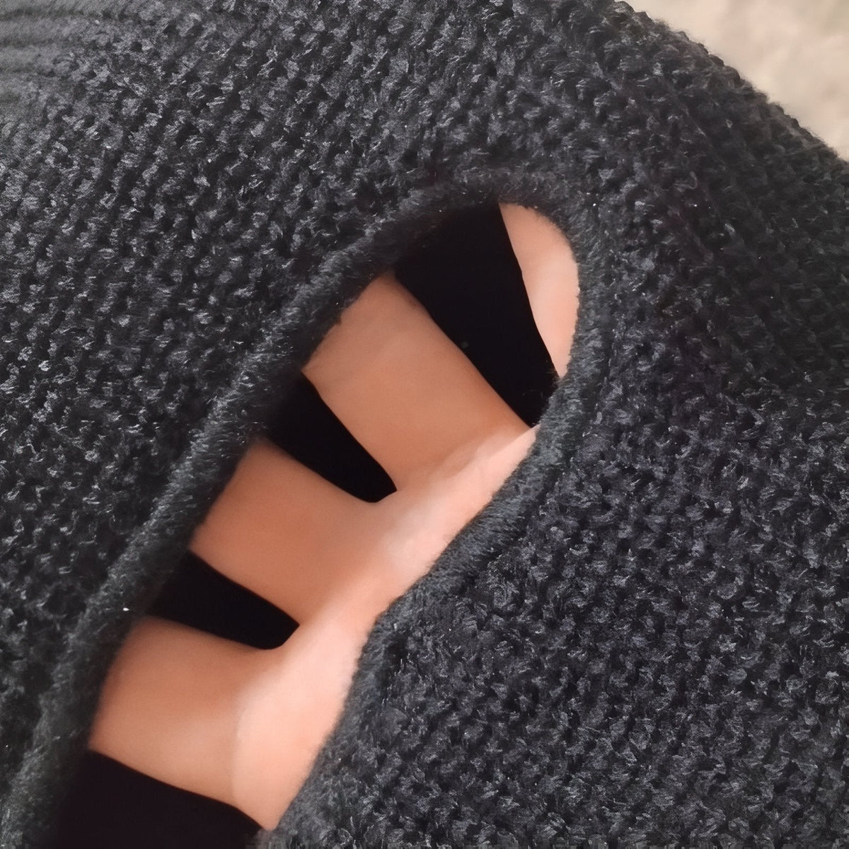 Close-up of the grey rib knit at the eye opening
