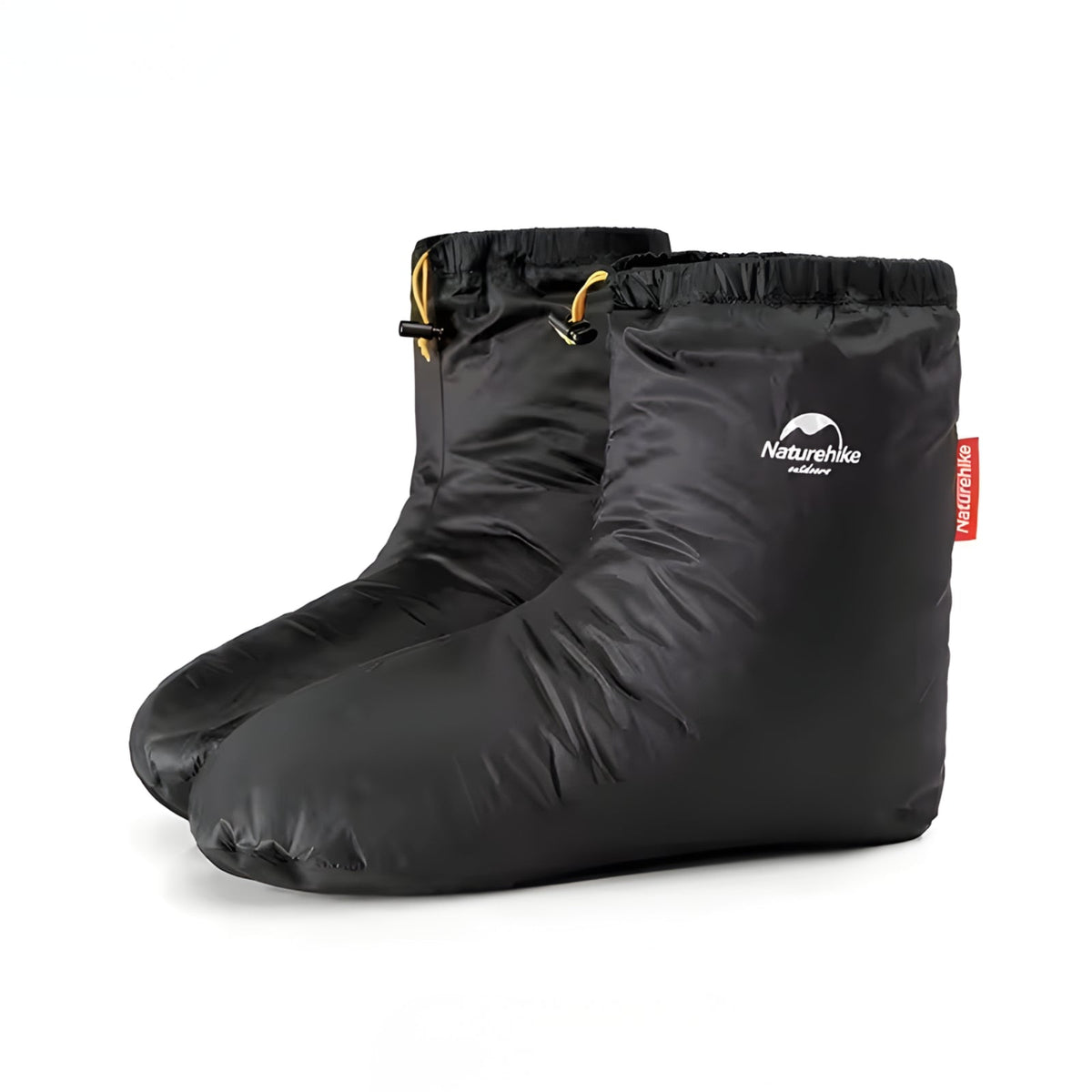 Pair of black down booties seen from the side, with drawcord cuffs and orange cord locks at the ankle