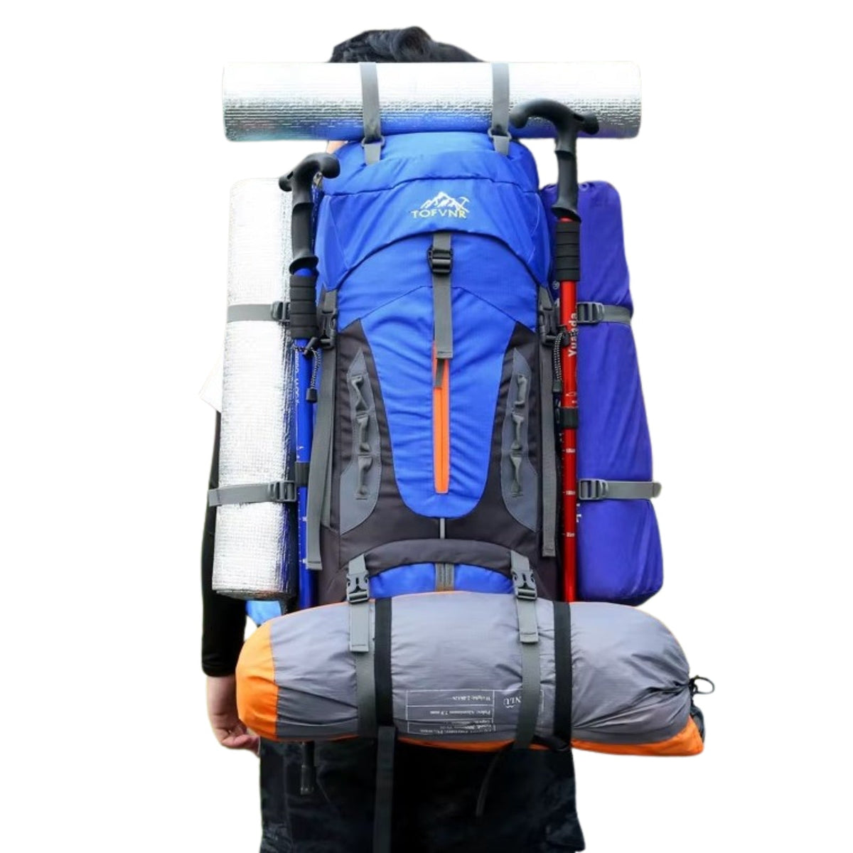 Blue hiking backpack worn and loaded with a rolled sleeping mat, trekking poles and a tent strapped on