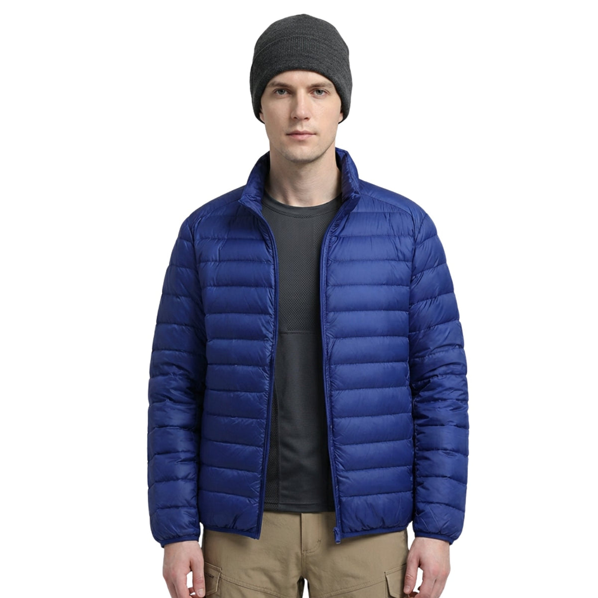 Man wearing the royal blue lightweight puffer jacket open over a charcoal T-shirt, front view