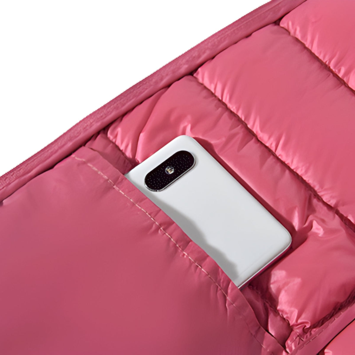 Close-up of a hand pocket on the vest holding a phone