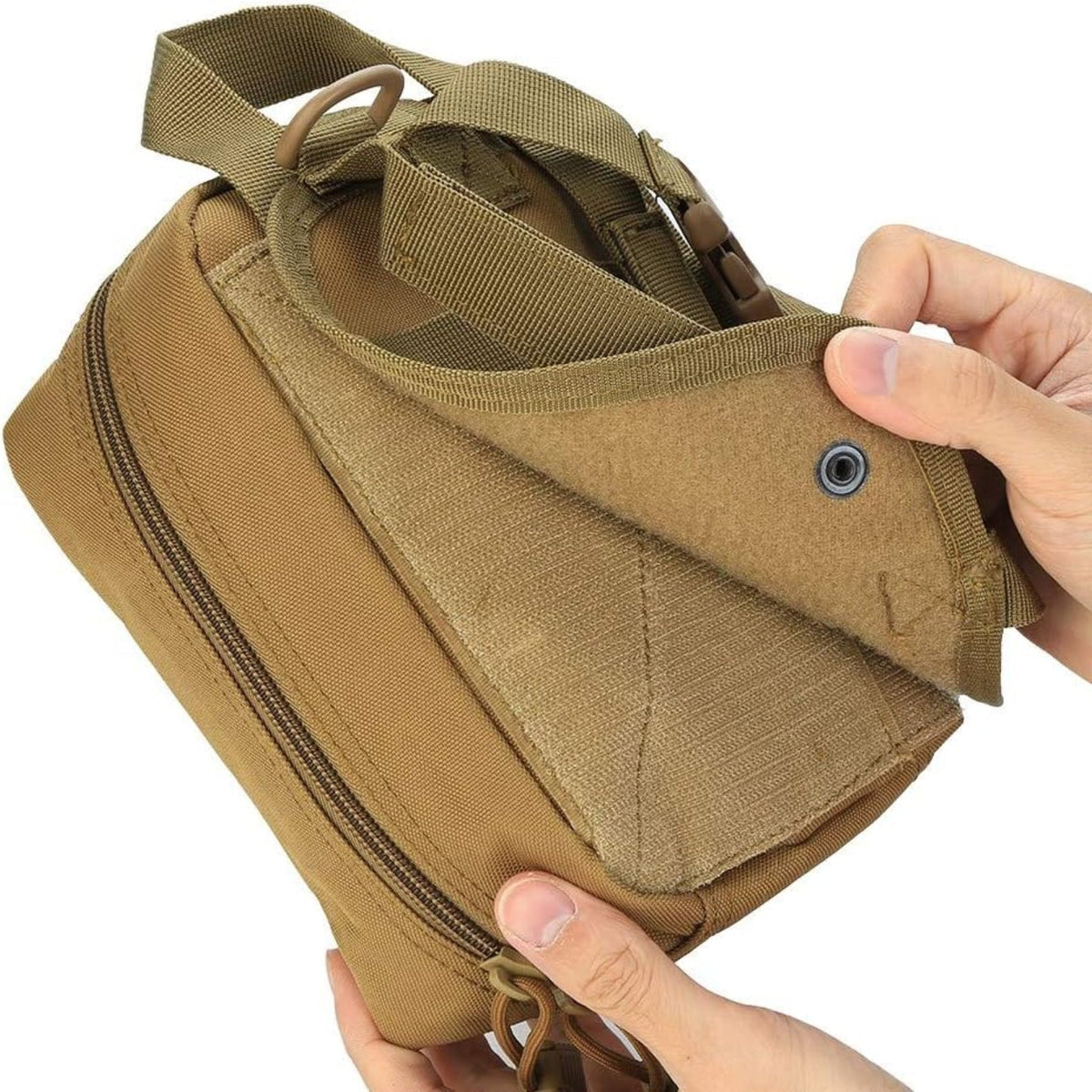 Hand holding the khaki pouch half open to show the rear panel and zip