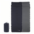Black inflatable sleeping mat shown from the top and from its grey underside, with its drawstring stuff sack