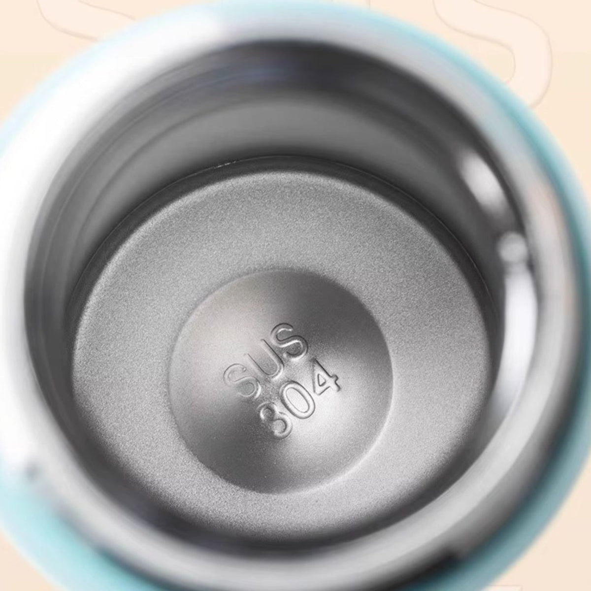 Inside of the bottle showing the stainless steel inner wall stamped SUS 304