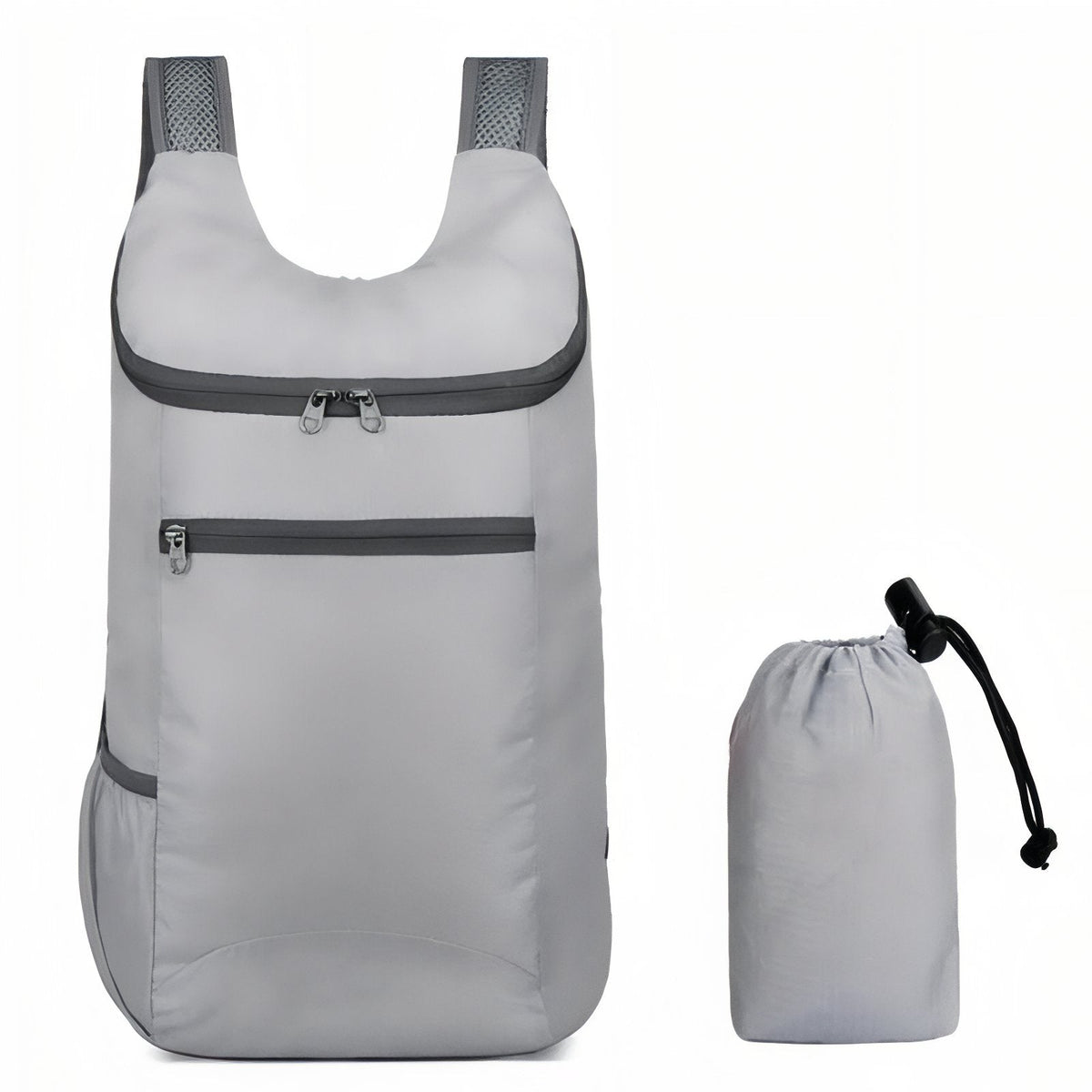 Light grey packable daypack beside its drawstring stuff sack