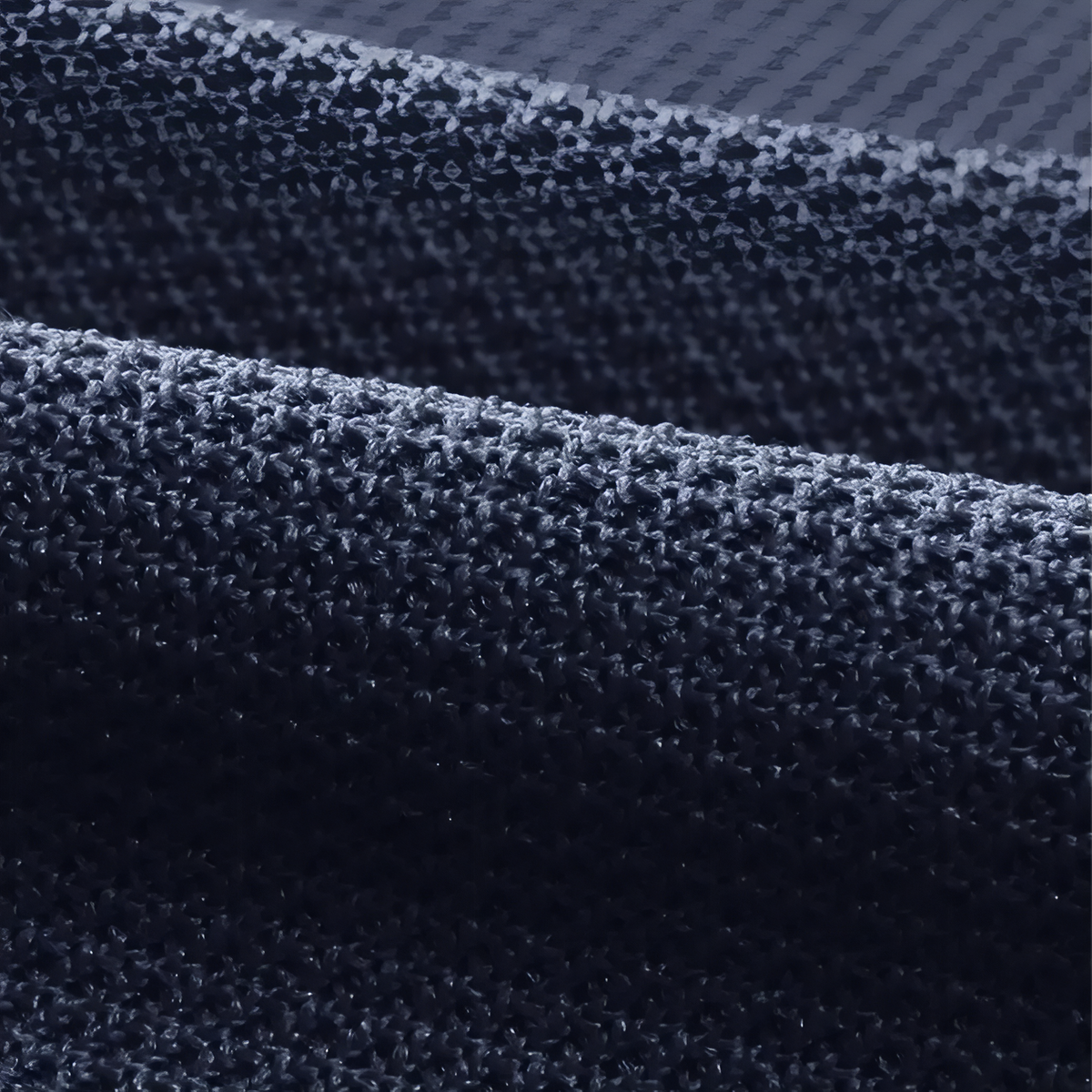 Close-up of the navy textured polyester knit