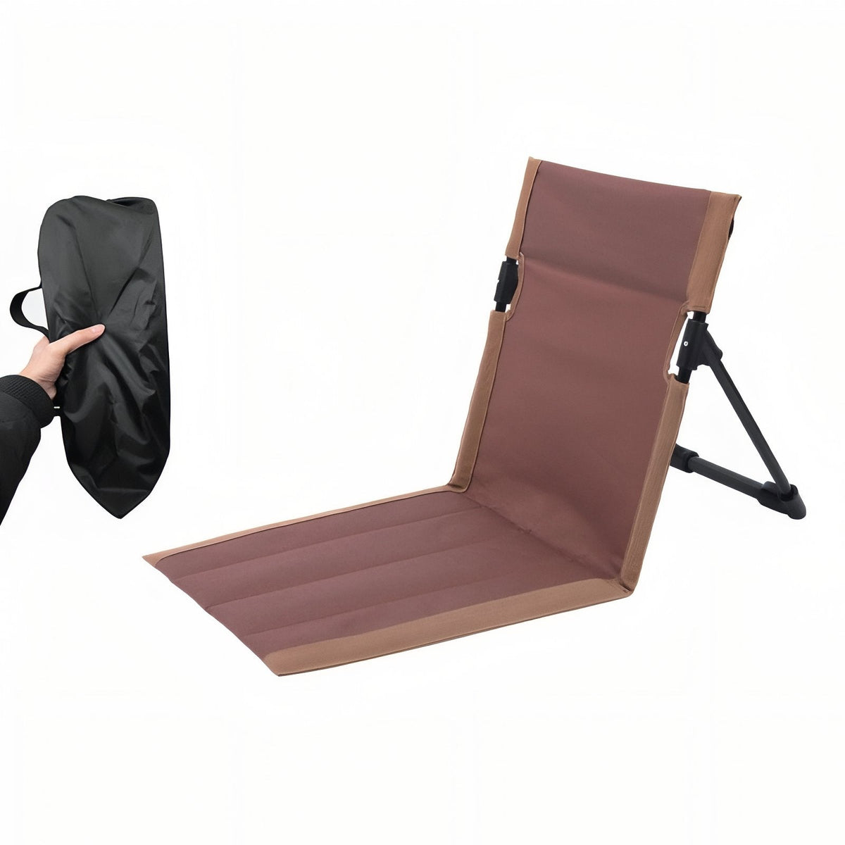 Brown folding ground chair set up, beside its black storage bag