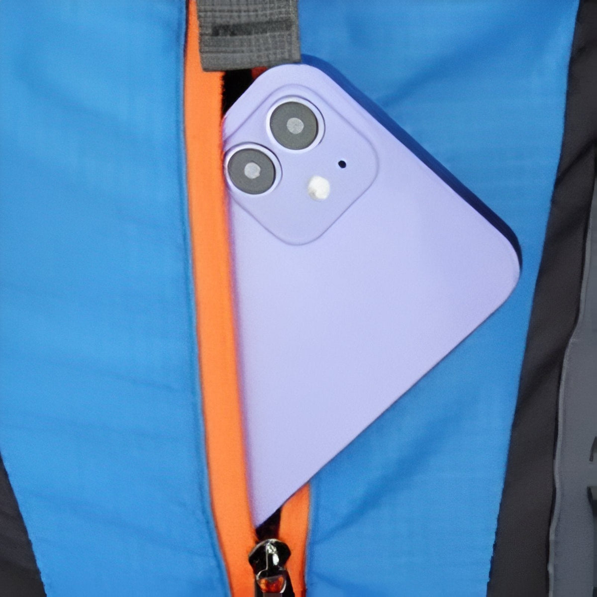 A phone slipping into a zipped pocket on the sky blue backpack