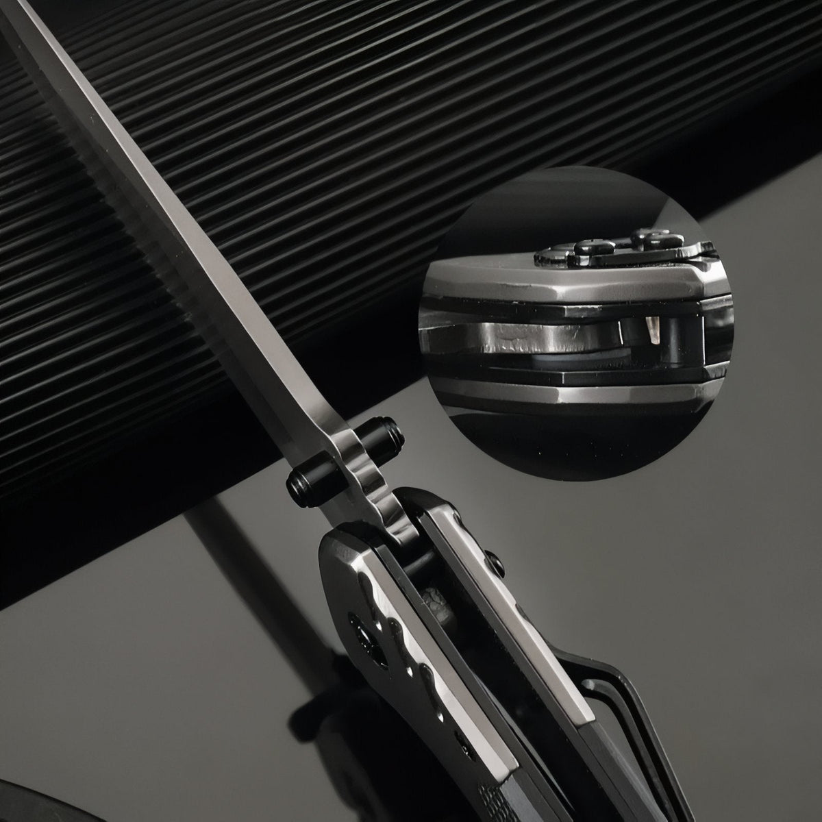 Close-up of the open blade near the pivot, with an inset of the handle edge