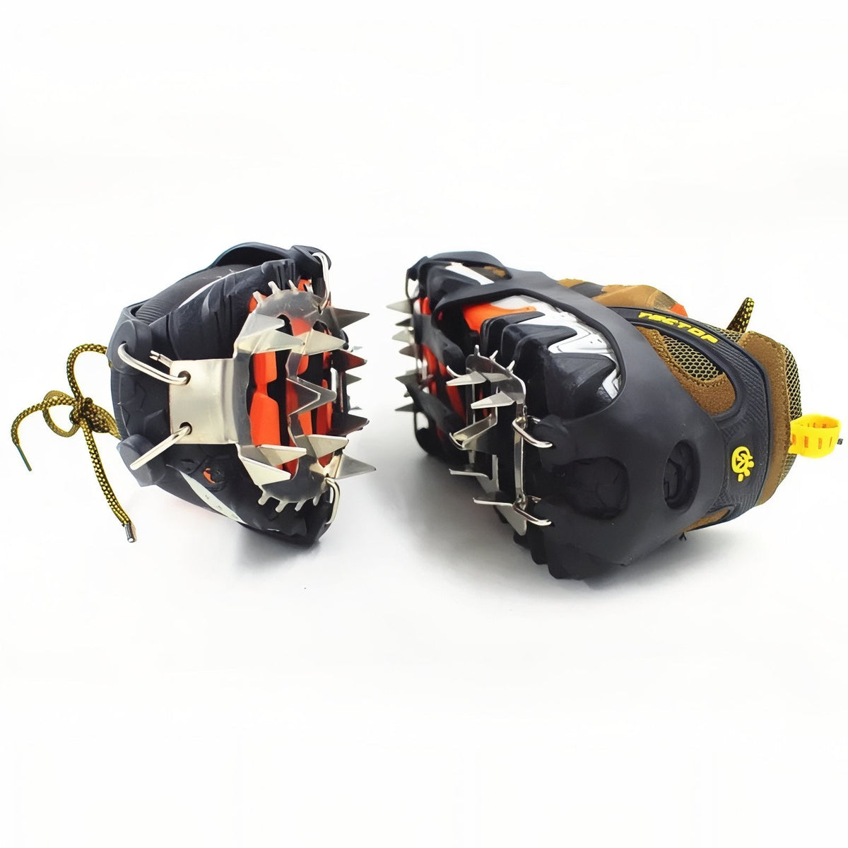 Front view of a pair of black crampons fitted on hiking shoes, toe spikes pointing forward