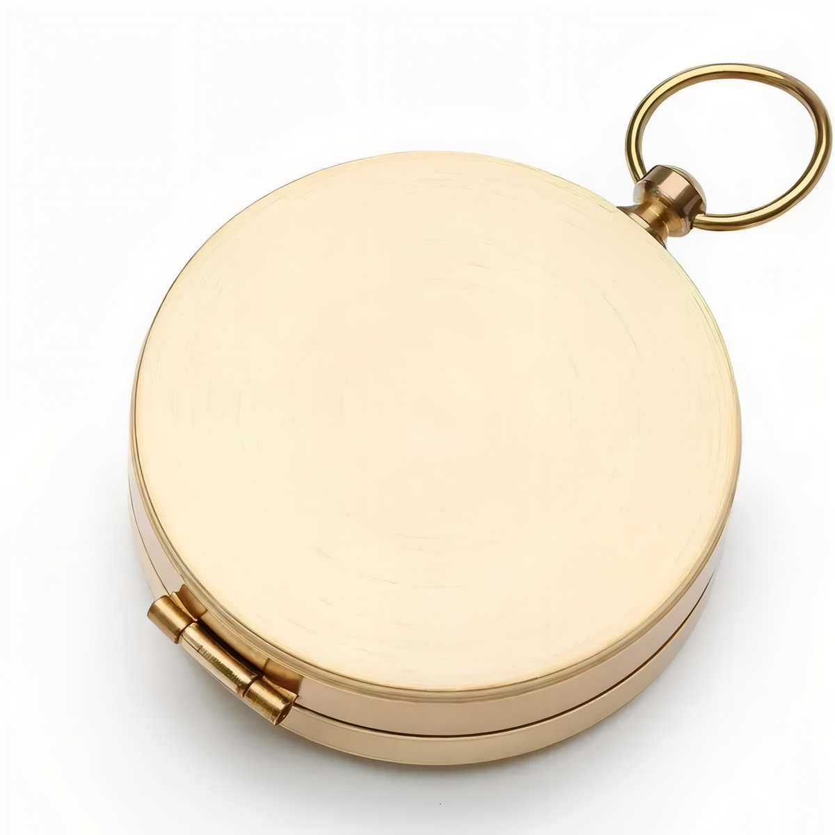 Gold-tone pocket compass closed, with its brushed lid and the ring at the hinge