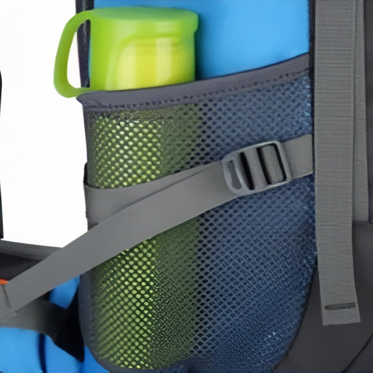 Close-up of the side mesh pocket holding a green water bottle, with a compression strap